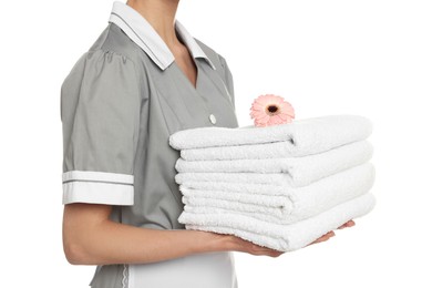 Chambermaid with towels and flower on white background