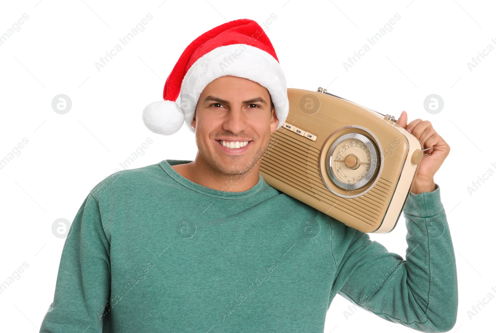 Photo of Happy man with vintage radio on white background. Christmas music