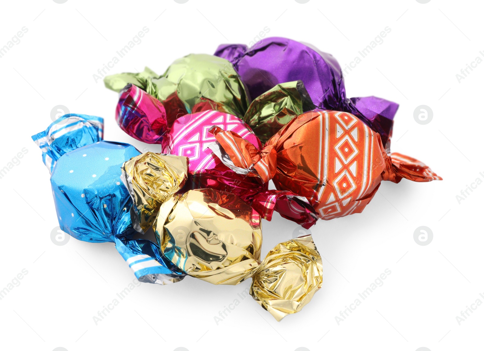 Photo of Pile of sweet candies in colorful wrappers on white background