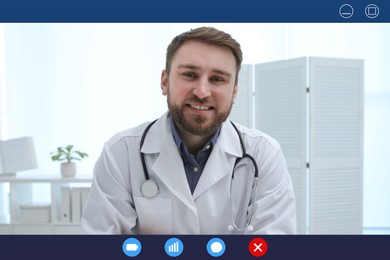 Pediatrician consulting patient online using video chat in clinic, view from webcam