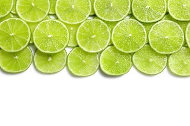 Photo of Fresh sliced ripe limes on white background, top view