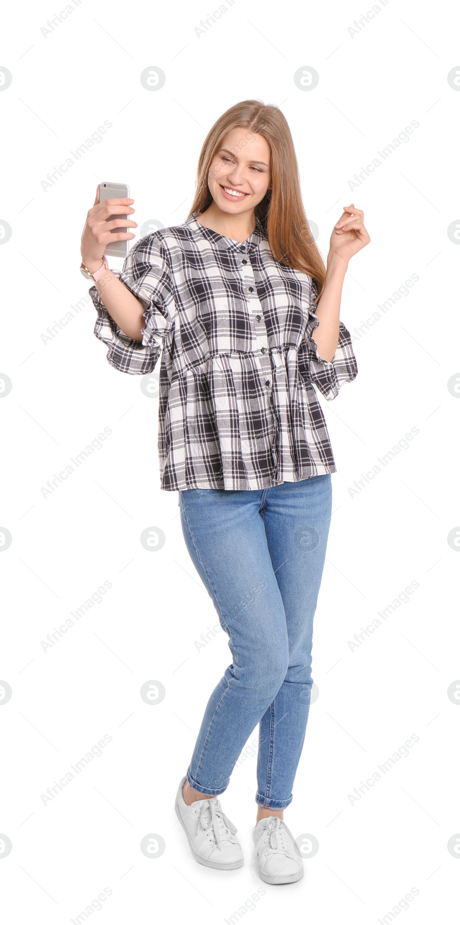 Photo of Young beautiful woman taking selfie against white background