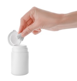 Photo of Woman taking chewing gums from jar on white background, closeup