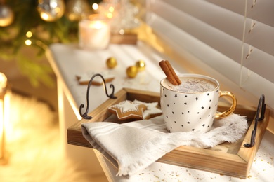 Composition with cup of hot drink on windowsill