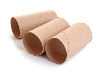 Photo of Empty paper toilet rolls on white background