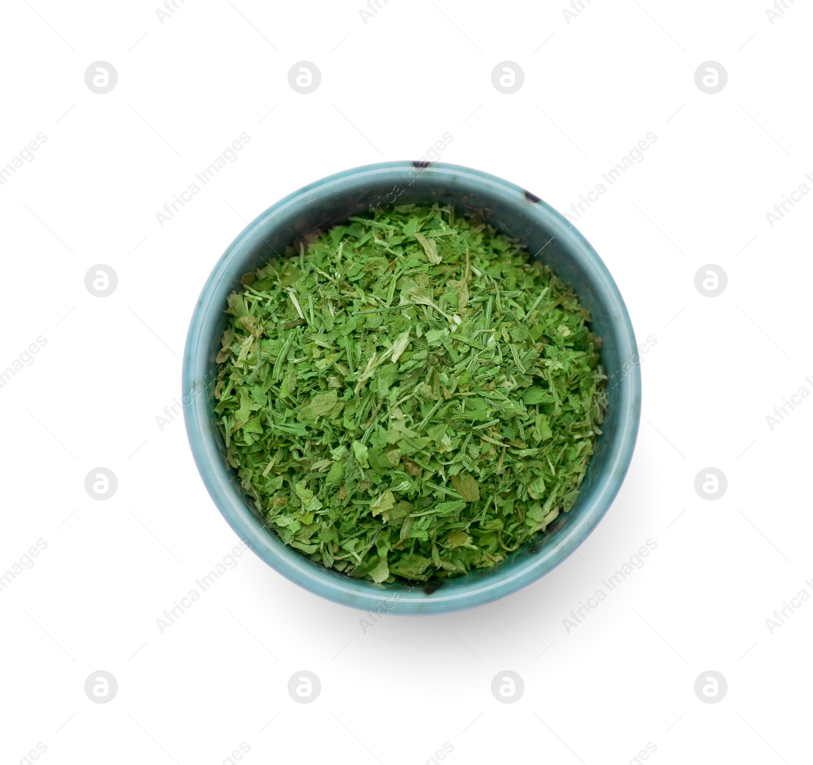Dried aromatic parsley in bowl isolated on white, top view Photo of Dried aromatic parsley in bowl isolated on white, top view