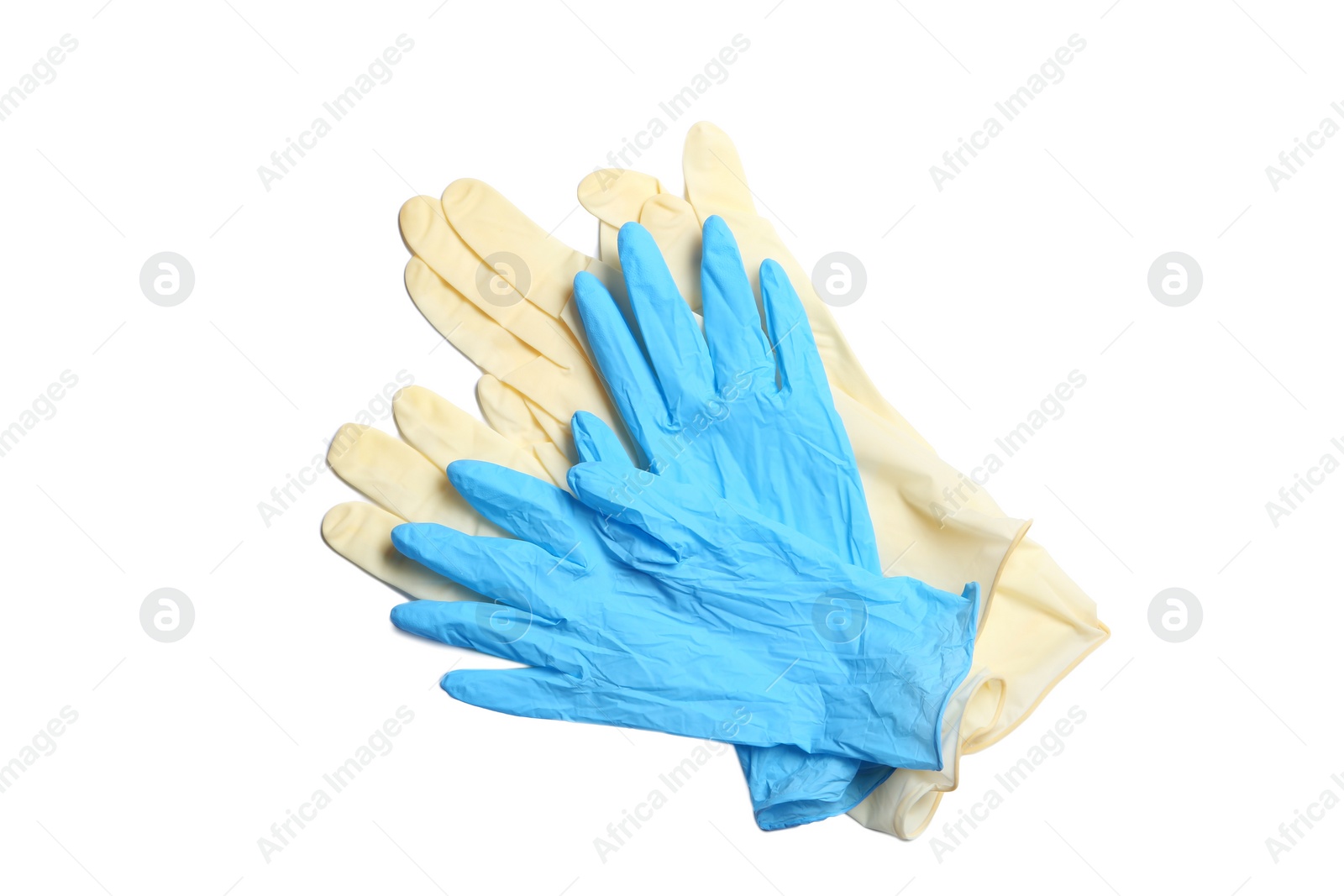 Photo of Different protective gloves on white background, top view. Medical item