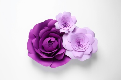 Different beautiful flowers of paper on white background, top view