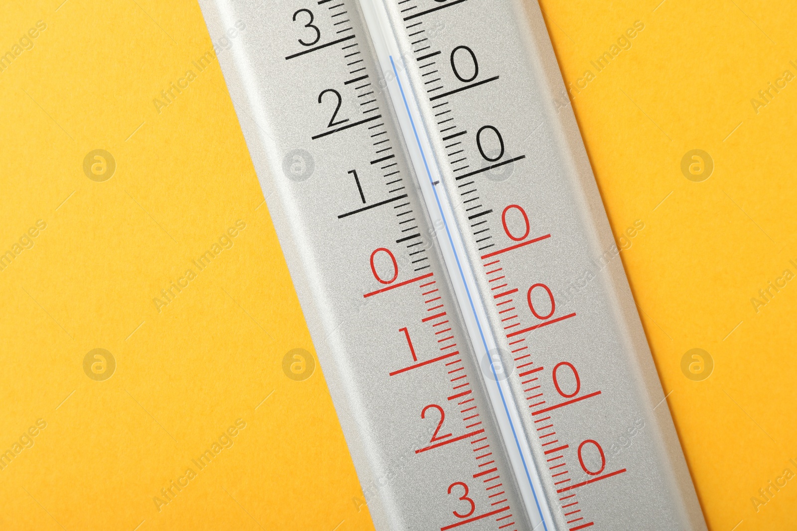 Photo of Modern weather thermometer on yellow background, closeup