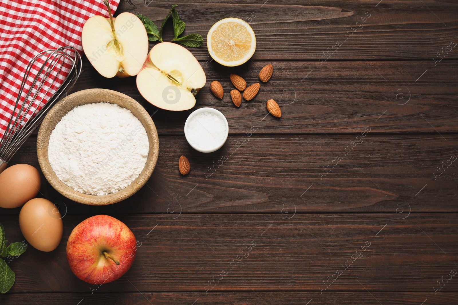 Photo of Flat lay composition with fresh products on wooden table, space for text. Healthy cooking