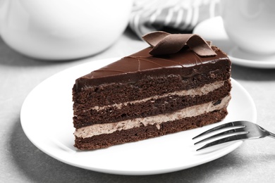 Photo of Delicious fresh chocolate cake served on table, closeup