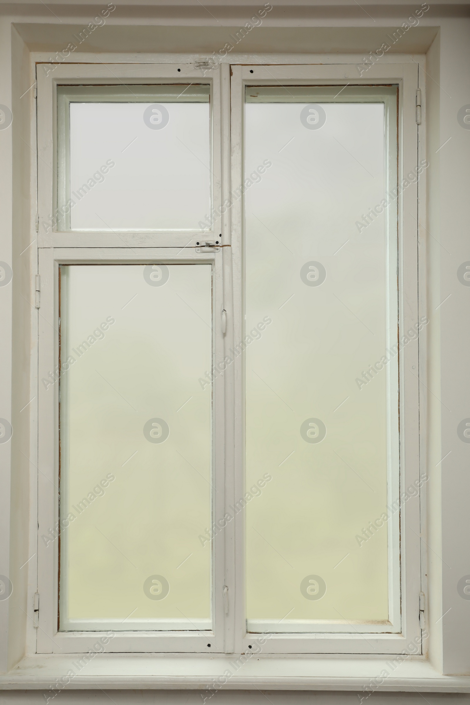 Photo of Old white window with wooden sill in room