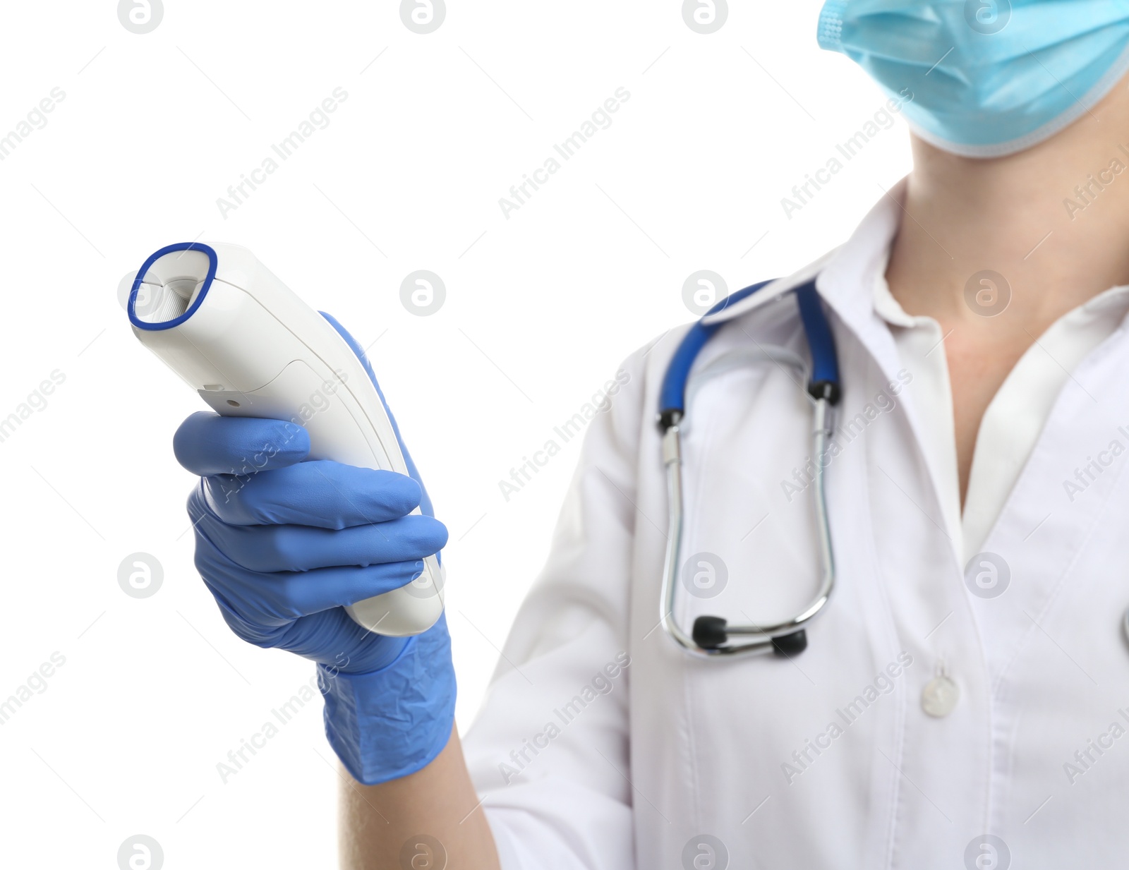 Photo of Doctor in latex gloves holding non contact infrared thermometer on white background, closeup. Measuring temperature