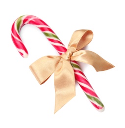 Photo of Tasty candy cane with bow on white background. Festive treat