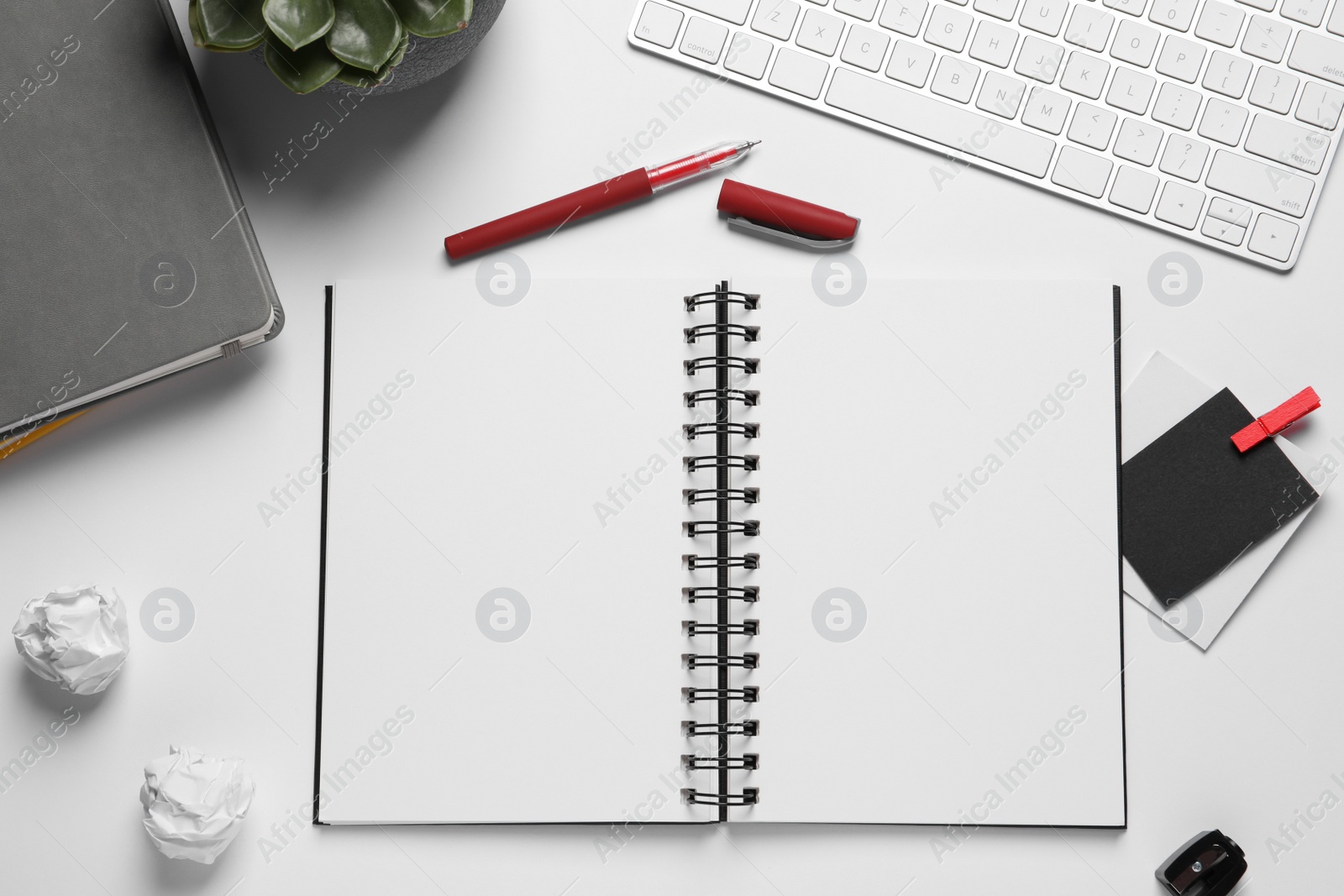 Photo of Flat lay composition with stylish notebooks on white table