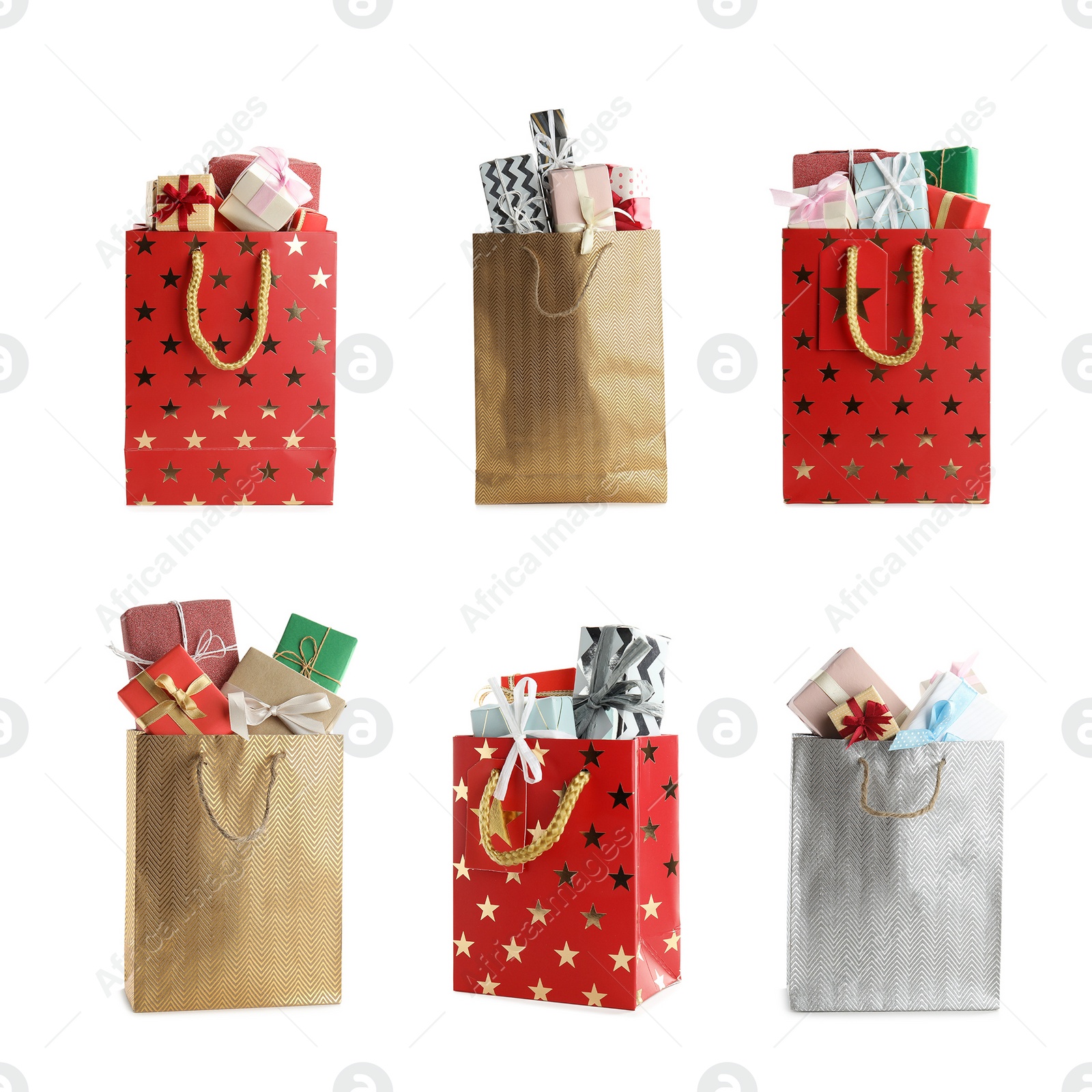 Image of Set of paper shopping bags with gifts on white background