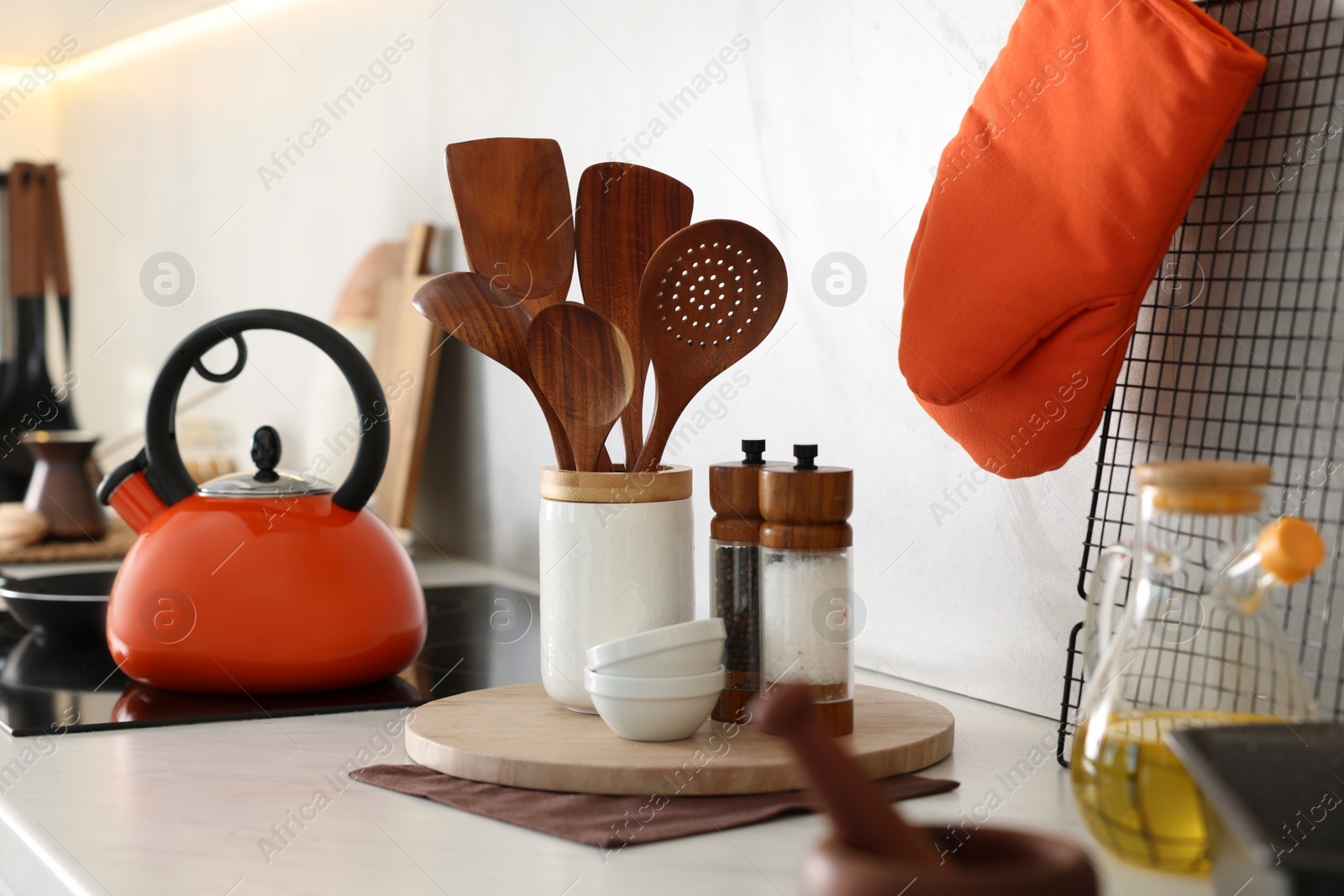 Photo of Set of different utensils and dishes on countertop in kitchen