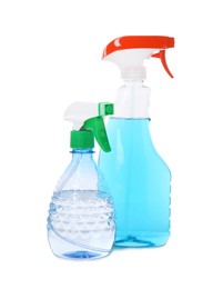 Plastic spray bottles with liquid isolated on white