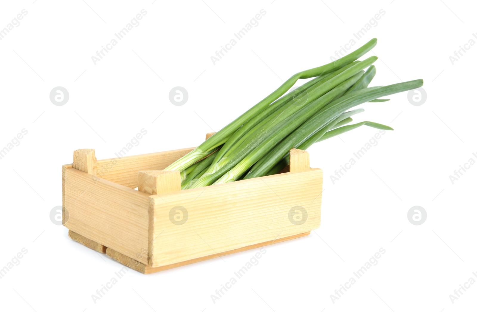 Photo of Fresh green spring onions in wooden crate isolated on white