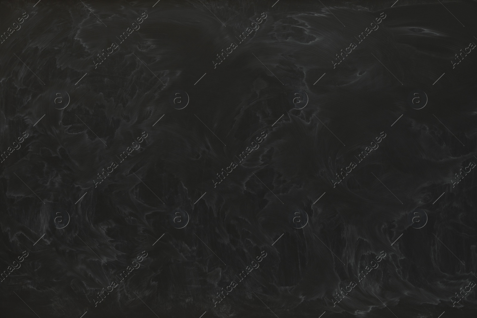 Photo of Dirty black chalkboard as background. School equipment