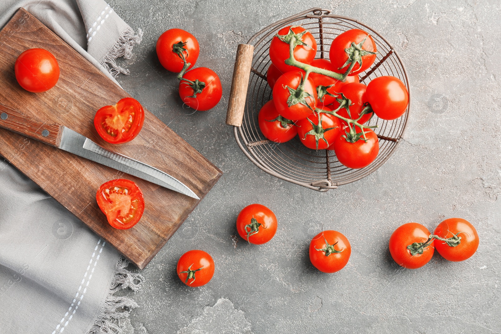 Photo of Flat lay composition with ripe tomatoes on grey background