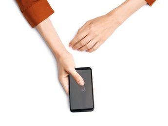 Photo of Woman with smartphone on white background, top view. Closeup of hands