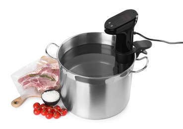Photo of Thermal immersion circulator in pot and ingredients on white background. Sous vide cooking