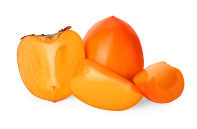 Photo of Whole and cut delicious ripe juicy persimmons on white background