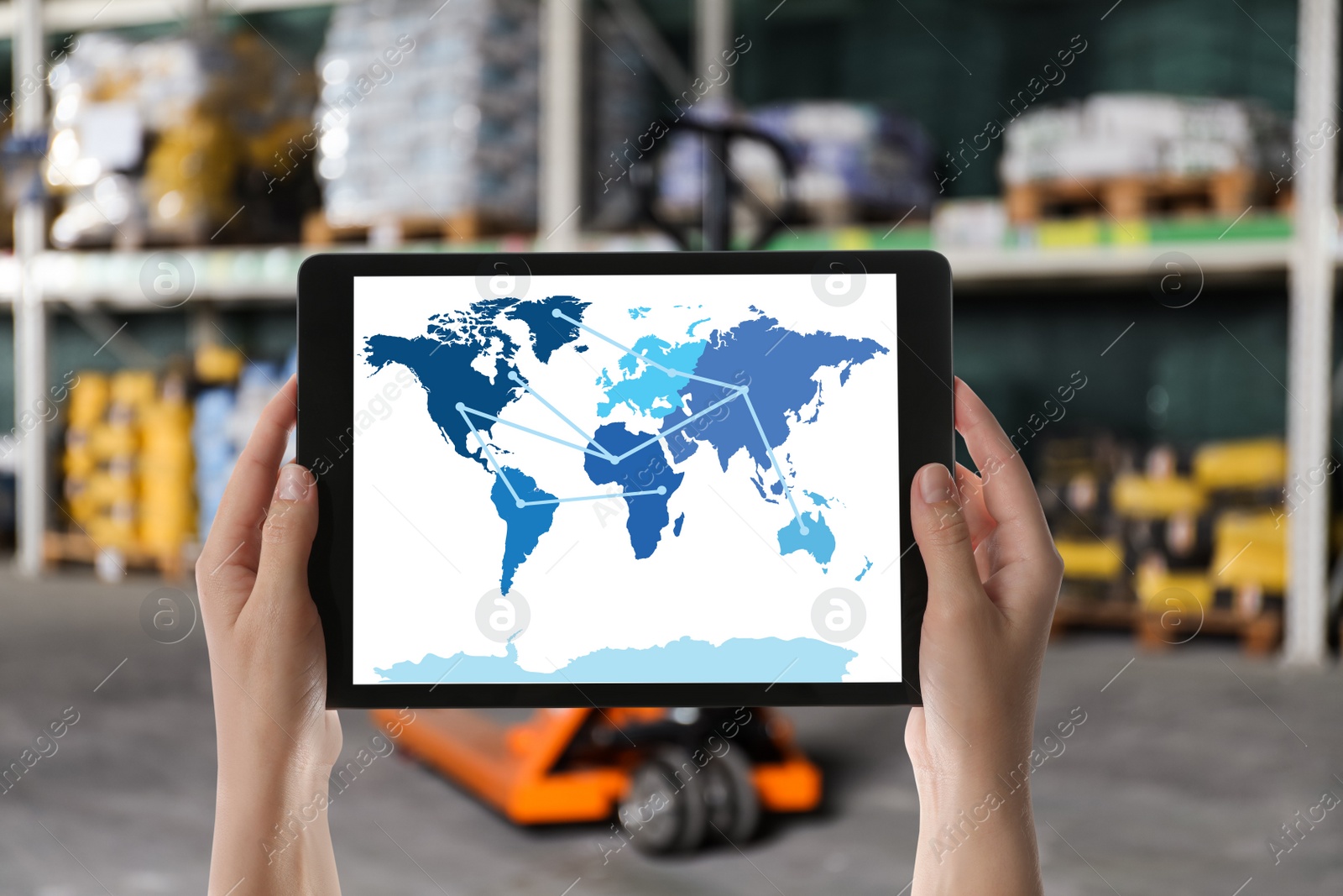 Image of Wholesale trading. Woman tablet with world map illustration at warehouse, closeup 