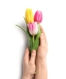 Photo of Girl holding beautiful spring tulips on light background, closeup. International Women's Day