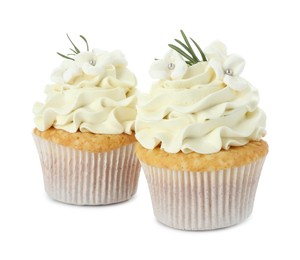 Tasty Easter cupcakes with vanilla cream isolated on white