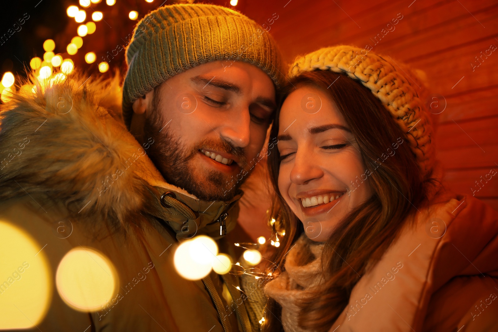 Photo of Happy couple spending time at Christmas fair