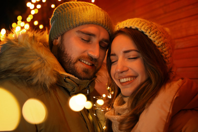 Happy couple spending time at Christmas fair