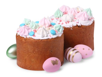 Photo of Traditional Easter cakes with meringues and painted eggs isolated on white