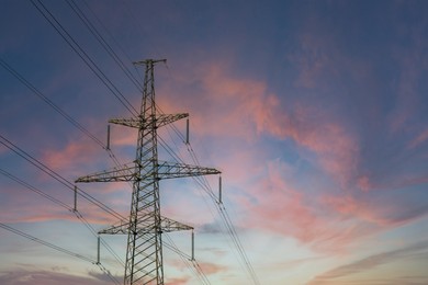 Photo of Telephone pole with cables at sunset outdoors, space for text