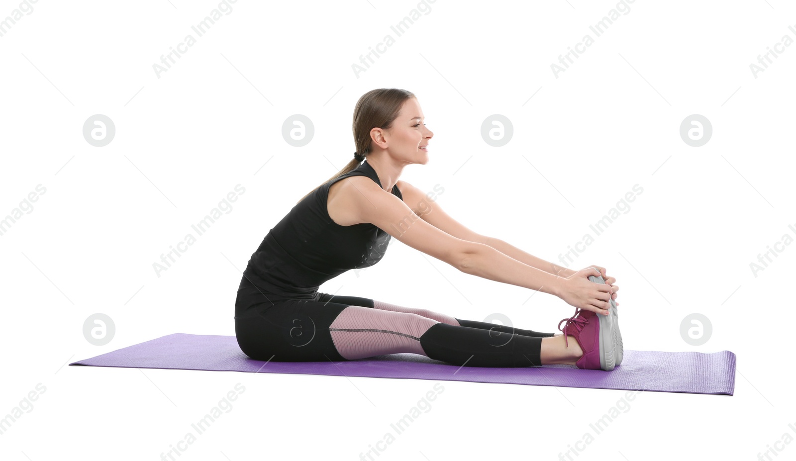 Photo of Young woman doing sports exercises isolated on white. Home fitness