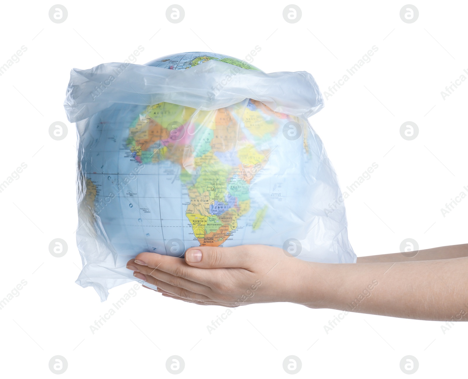 Photo of Woman holding globe in plastic bag on white background, closeup. Environmental protection concept
