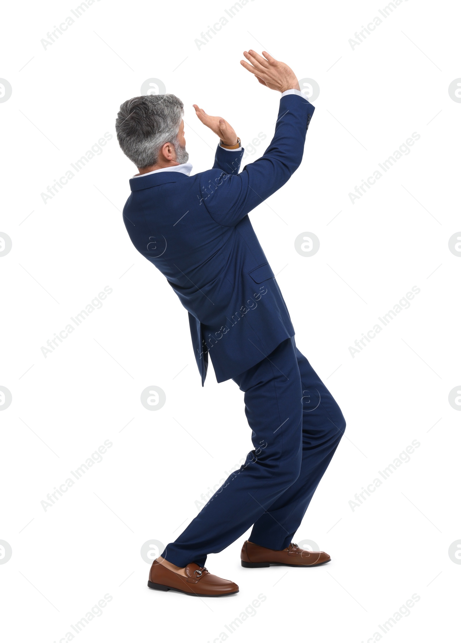 Photo of Mature businessman in stylish clothes avoiding something on white background