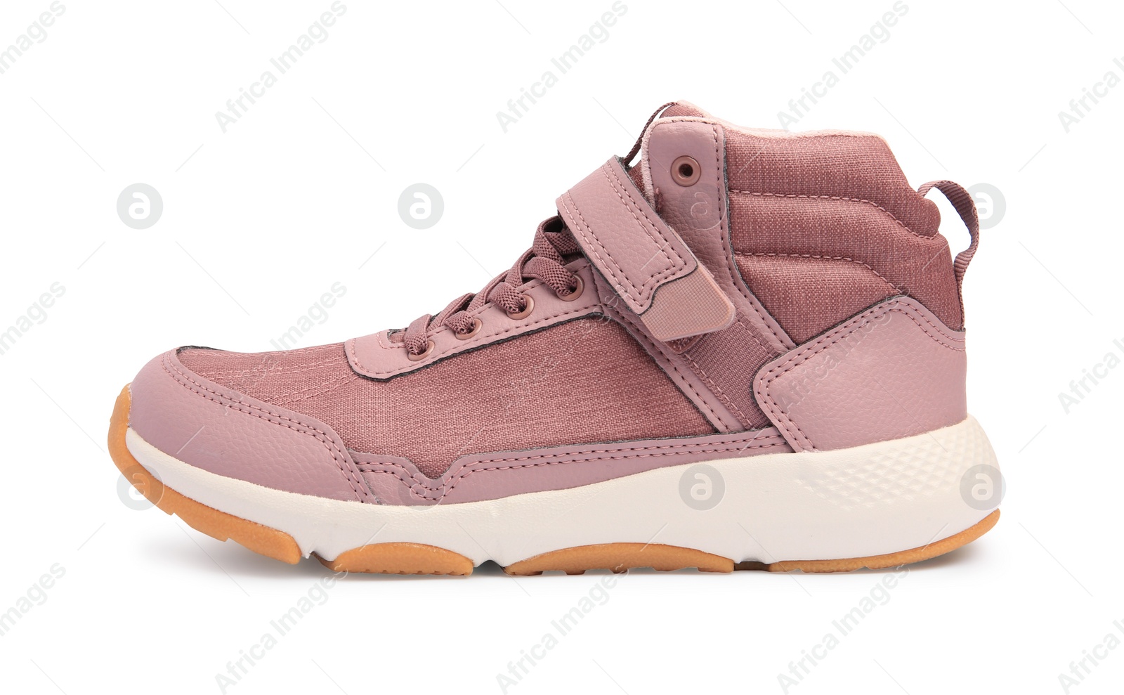 Photo of Stylish pink kid's sneaker isolated on white