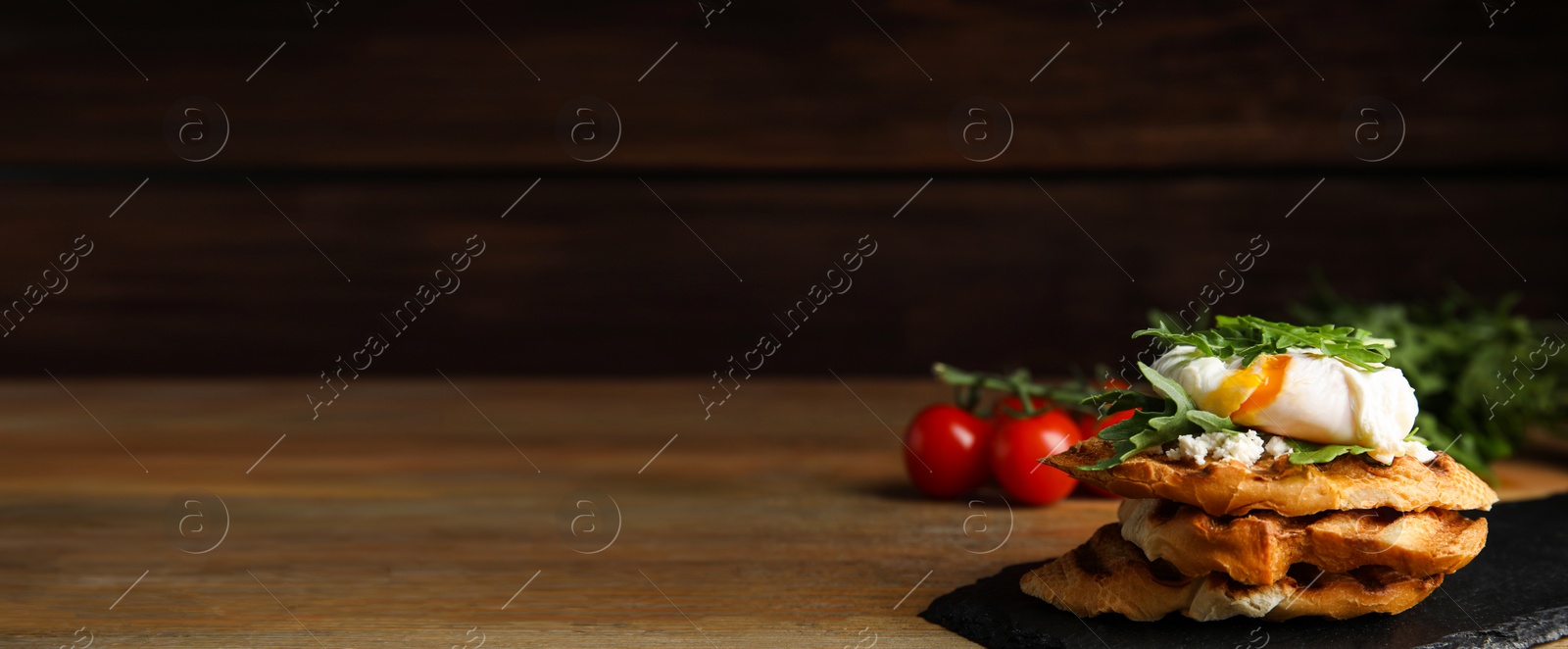 Image of Delicious sandwich with arugula and egg on wooden table, space for text. Banner design 