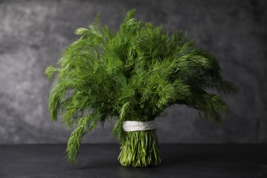 Bunch of fresh green dill on black table