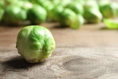 Photo of Fresh Brussels sprout on table. Space for text