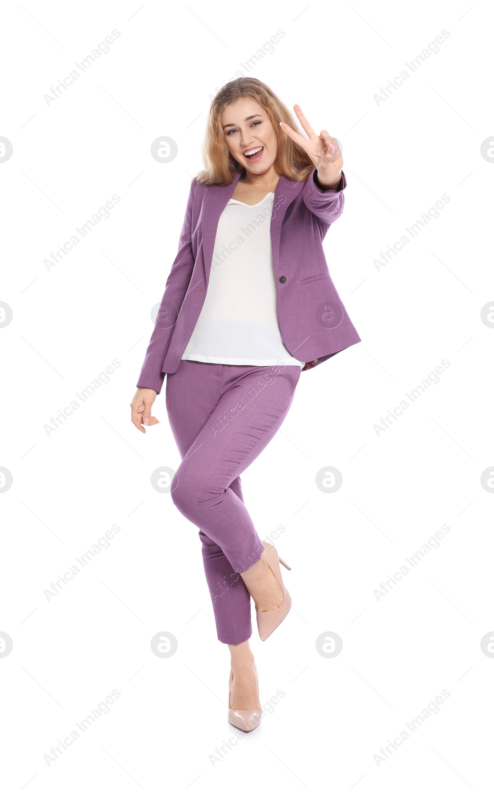 Photo of Happy young businesswoman showing victory gesture on white background