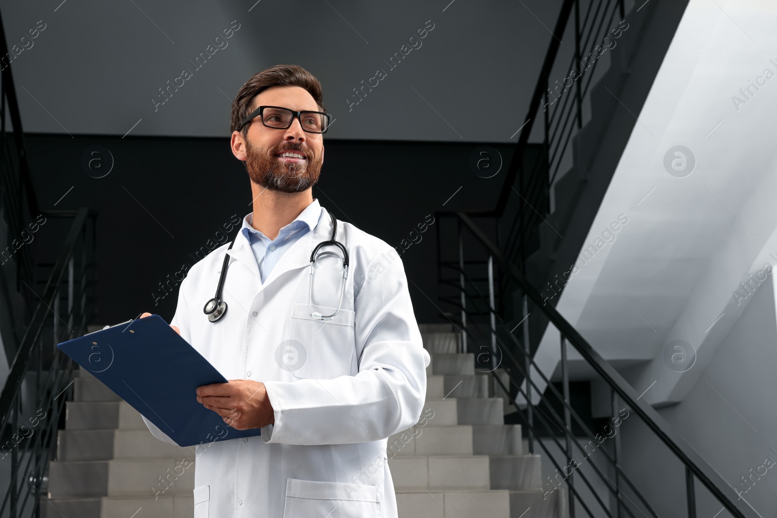 Photo of Doctor with stethoscope and clipboard in hospital