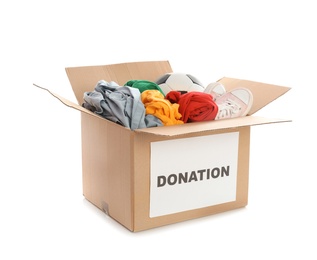 Photo of Carton box with donations on white background