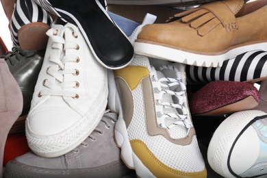 Photo of Different colorful female shoes as background, closeup