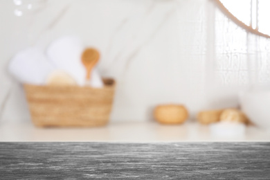 Empty table and blurred view of stylish bathroom interior