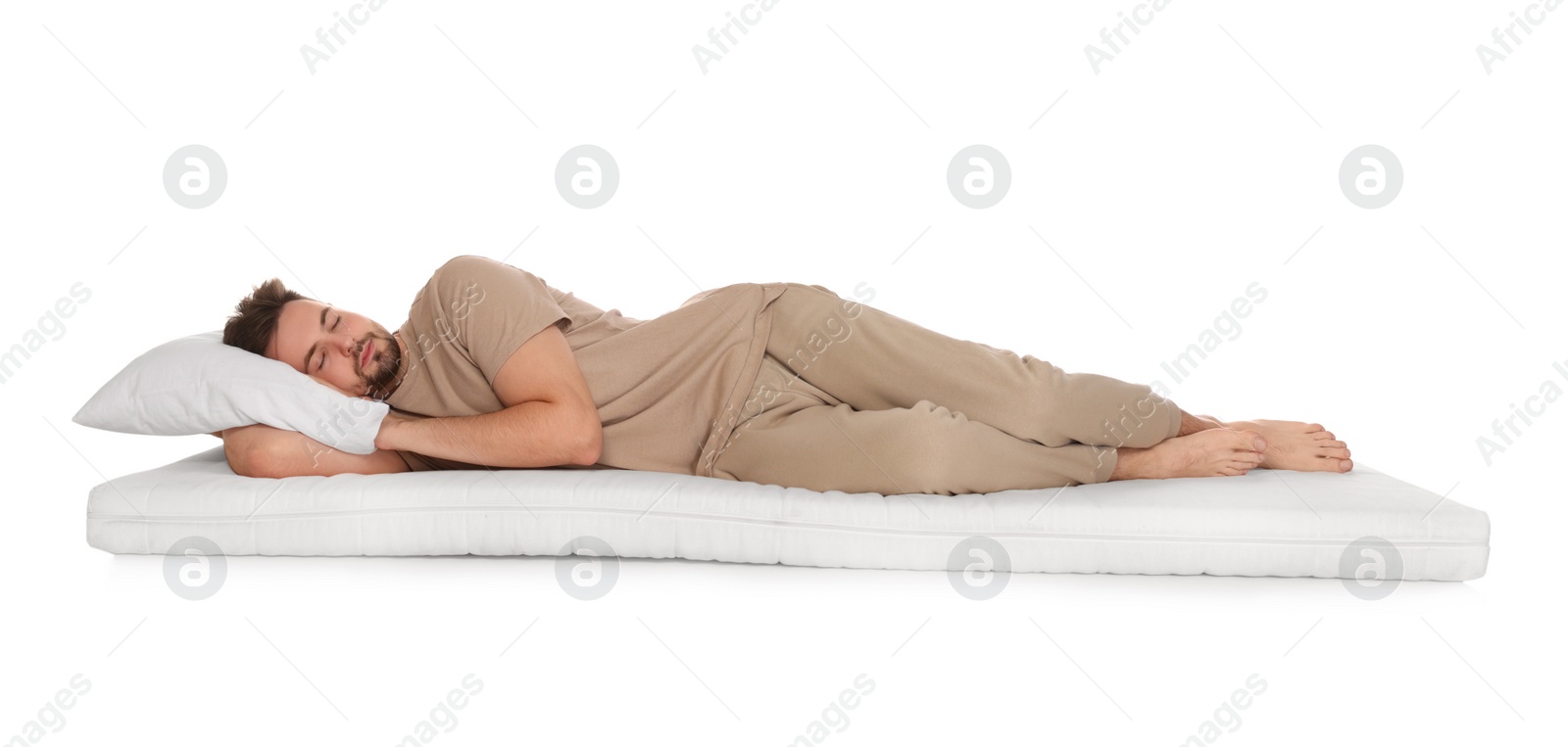 Photo of Man sleeping on soft mattress against white background