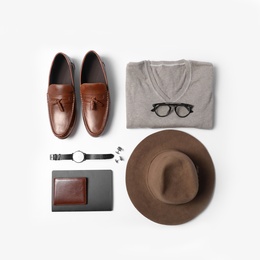 Stylish male autumn outfit and accessories on white background, flat lay. Trendy warm clothes