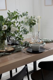 Festive table setting with beautiful tableware and decor indoors